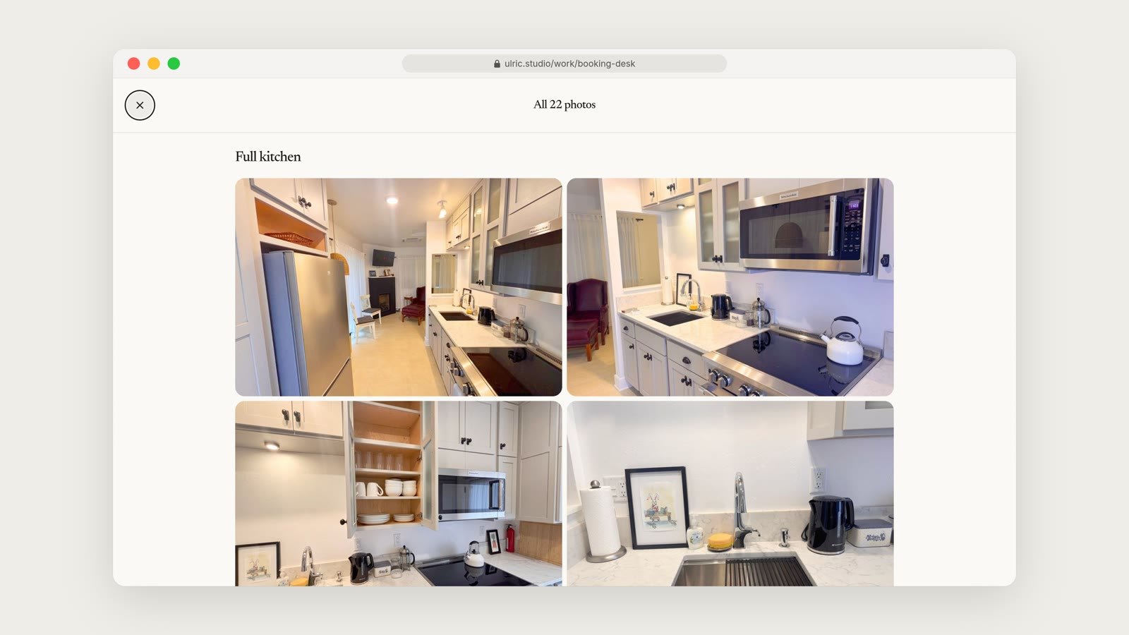 The photo gallery for the full kitchen, a grid of twelve images showing the stainless steel fridge, stove, counters, dining nook and framed art.