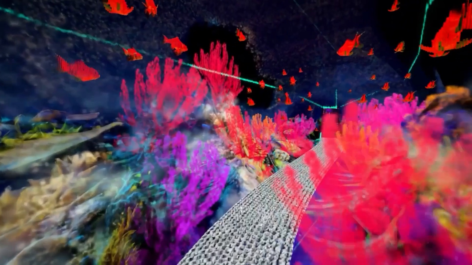 Still from a World Labs Spark 2.0 demonstration: a coral reef scene built from coloured Gaussian splats, with schools of red fish, rendered in a browser